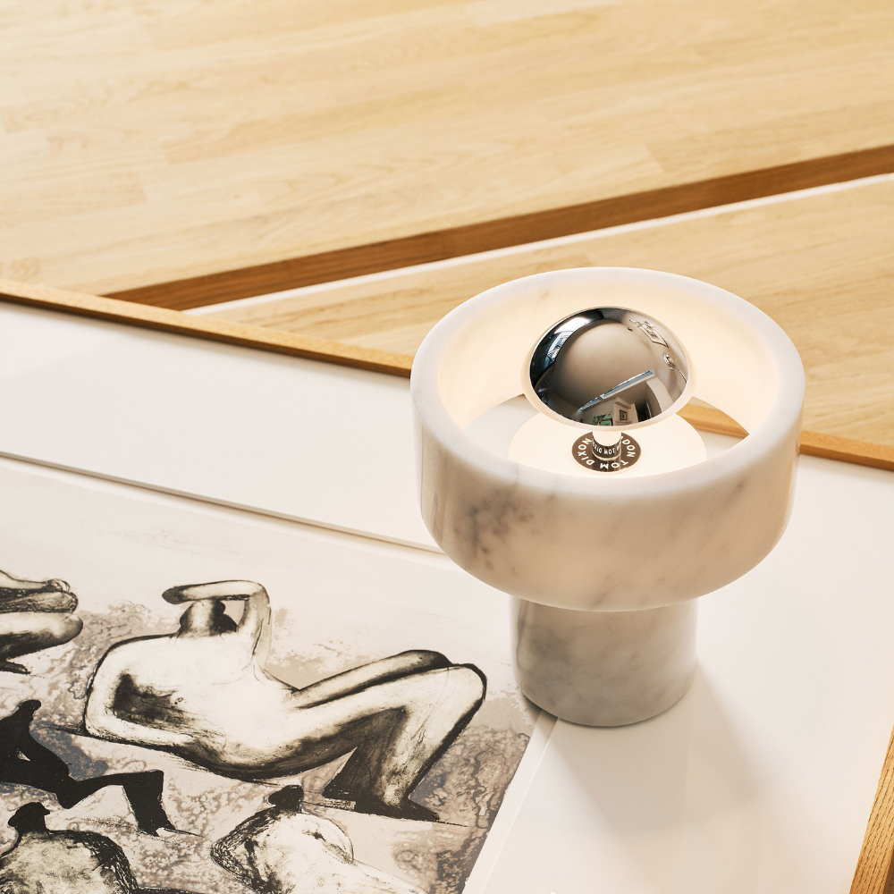 The Stone Portable Light by Tom Dixon in Silver on artwork.