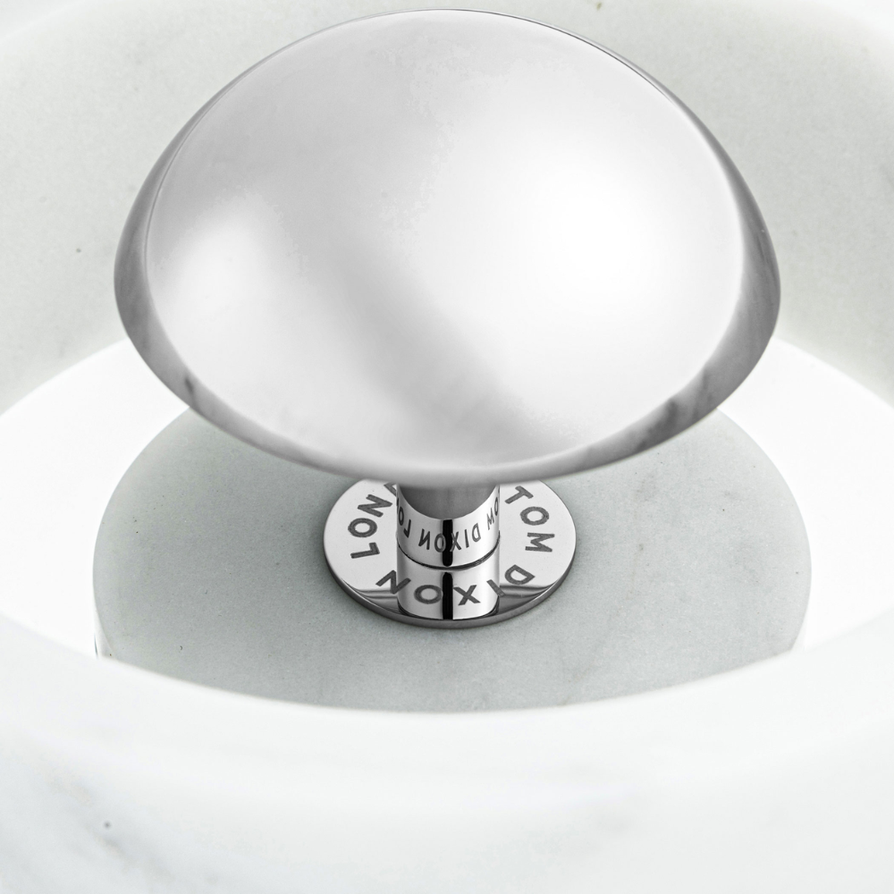 The silver diffuser of the Stone Portable Light by Tom Dixon. all-groups