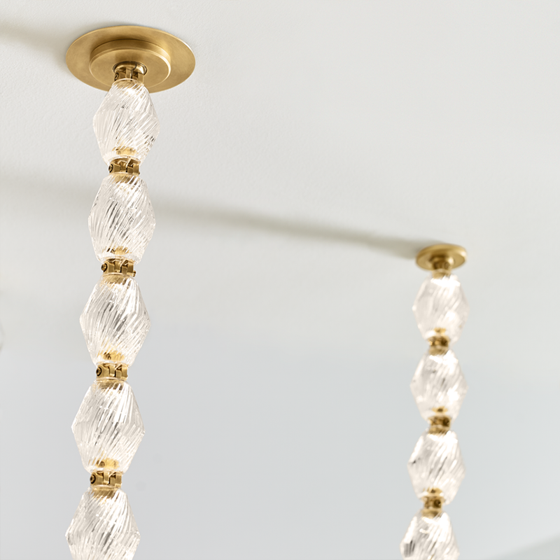 The Collier 108 Chandelier from Visual Comfort and Co in natural brass close-up of ceiling attachment.
