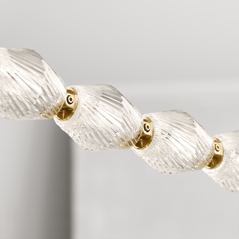 The Collier 84 Chandelier from Visual Comfort and Co in natural brass close up.