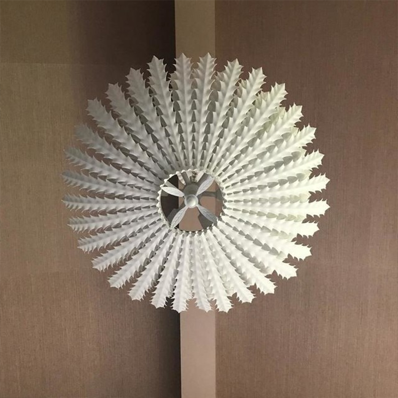 The Hampton Medium Chandelier from Visual Comfort and Co in plaster white in a family space.