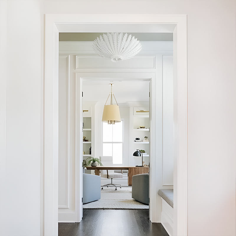 The Hampton Medium Chandelier from Visual Comfort and Co in plaster white in a living space.
