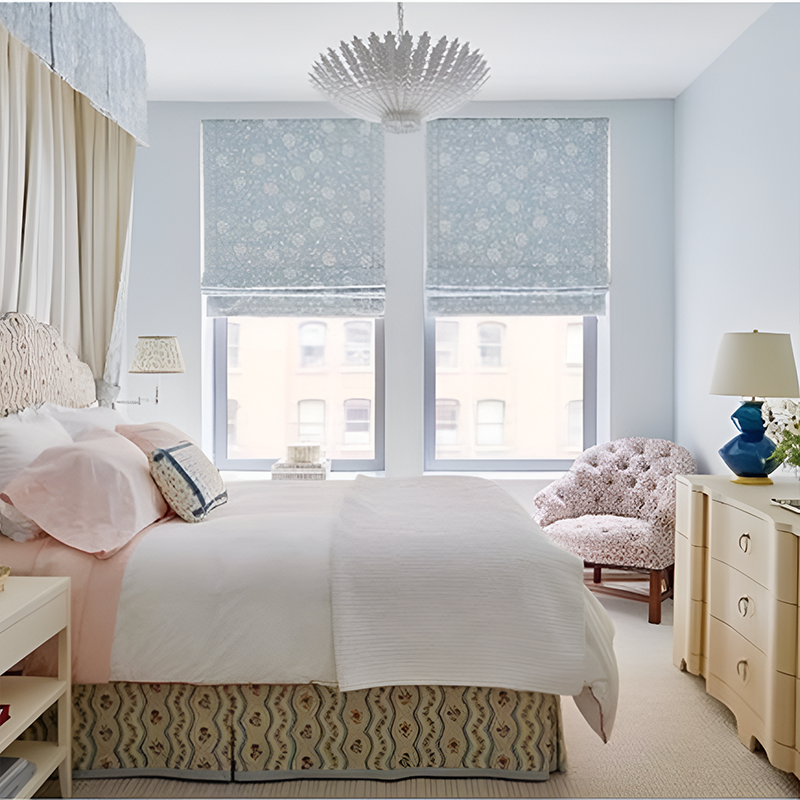 The Hampton Medium Chandelier from Visual Comfort and Co in plaster white in a primary bedroom.