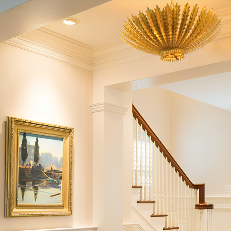 The Hampton Mini Chandelier from Visual Comfort & Co in antique gold in an entryway.