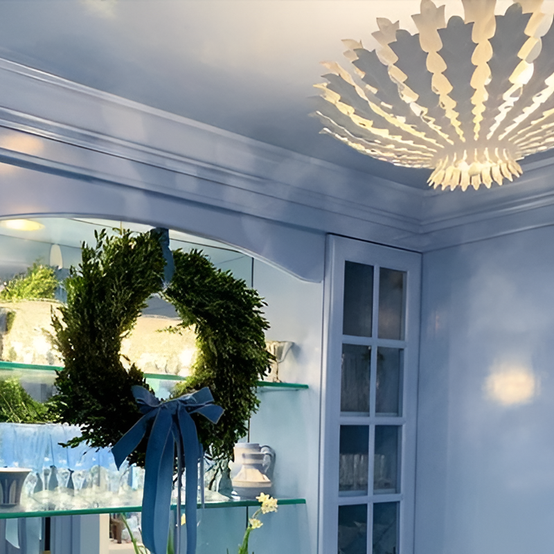 The Hampton Mini Chandelier from Visual Comfort and Co in plaster white in a dining room