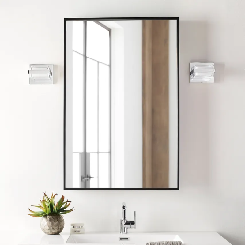 The Kamden 1-Light Bathroom Sconce from Visual Comfort & Co. in chrome in an en suite.
