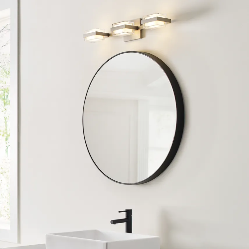 The Kamden 3-Light Bathroom Sconce from Visual Comfort & Co. in a en suite bathroom.