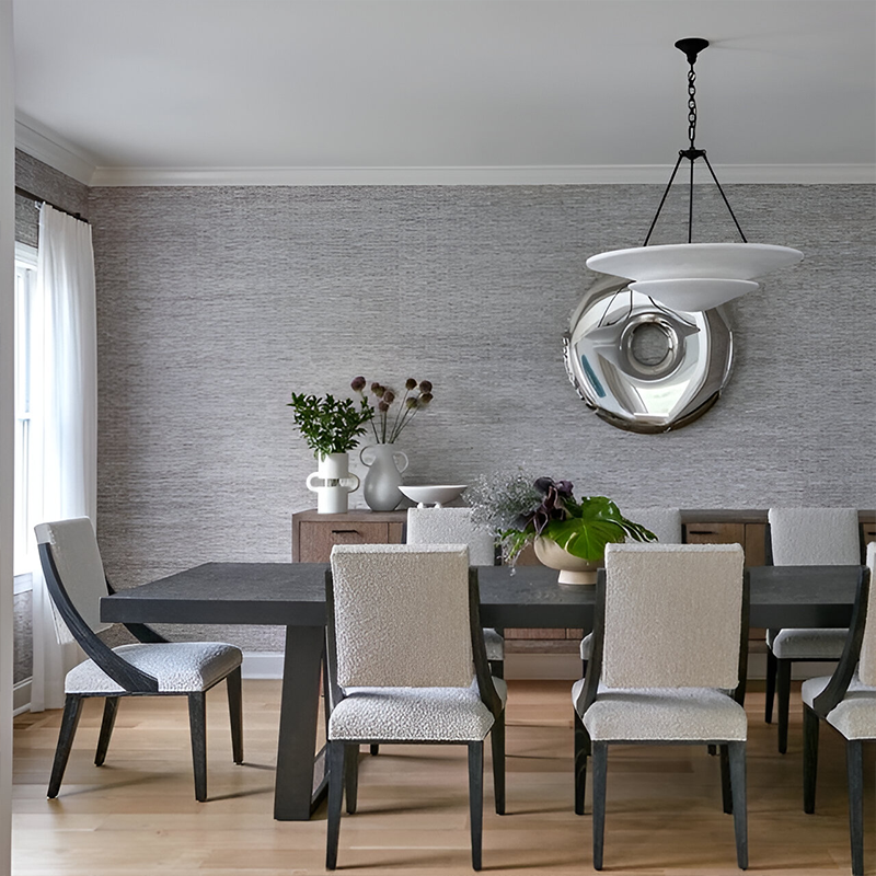 The Mollino Large Tiered Chandelier from Visual Comfort and Co in bronze in a dining room.