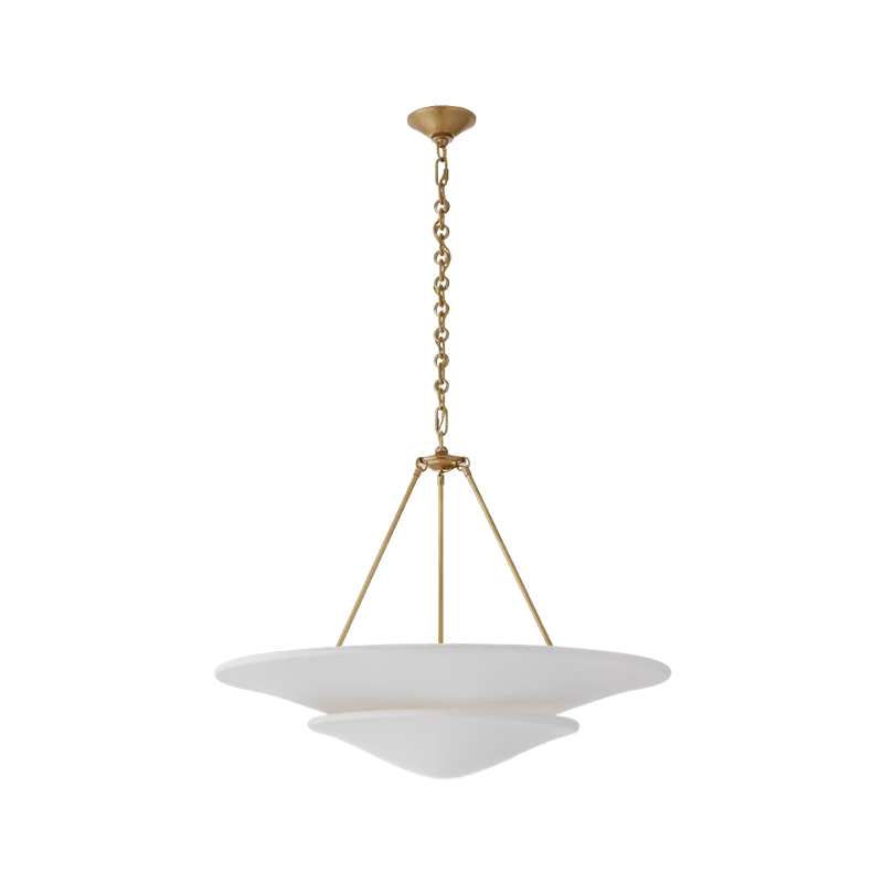 The Mollino Large Tiered Chandelier from Visual Comfort and Co in hand-rubbed antique brass.