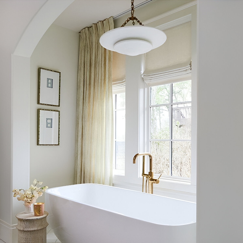 The Mollino Medium Tiered Chandelier from Visual Comfort and Co in bronze in primary bathroom.