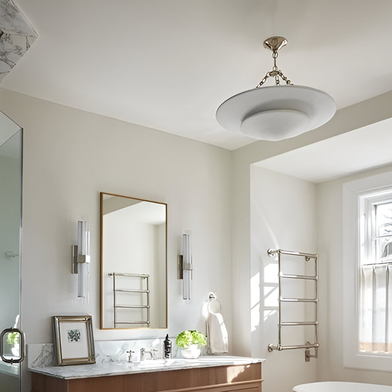 The Mollino Medium Tiered Chandelier from Visual Comfort and Co in polished nickel in a bathroom.