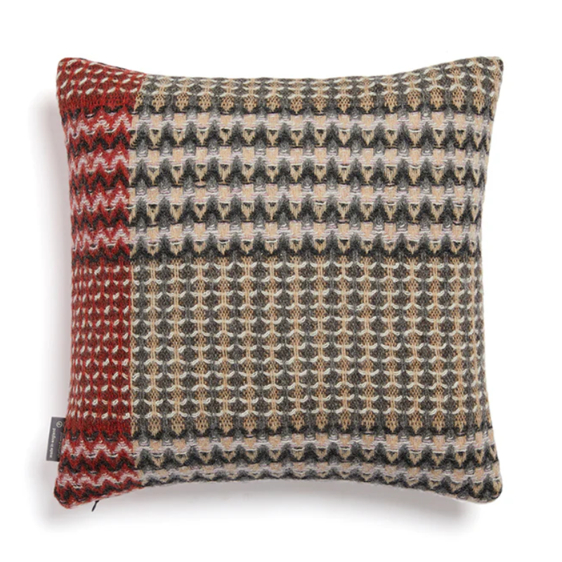 The Ansel Cushion by Wallace & Sewell is made of 100% shetland wool.