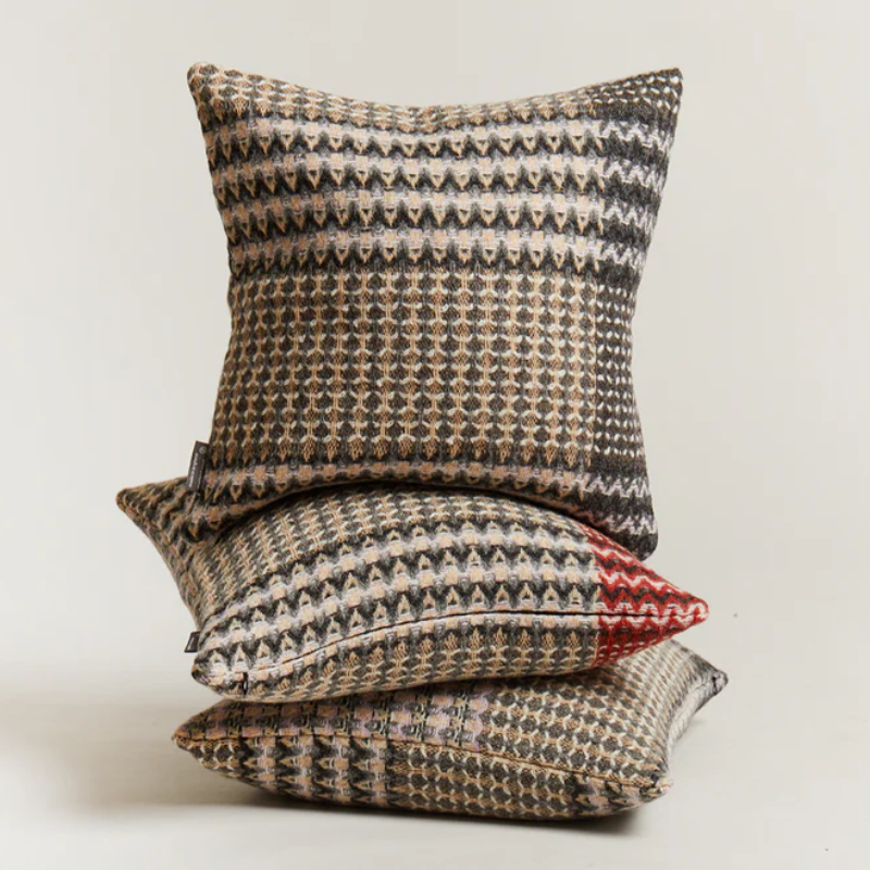 The Ansel Cushion by Wallace & Sewell is made of 100% shetland wool.