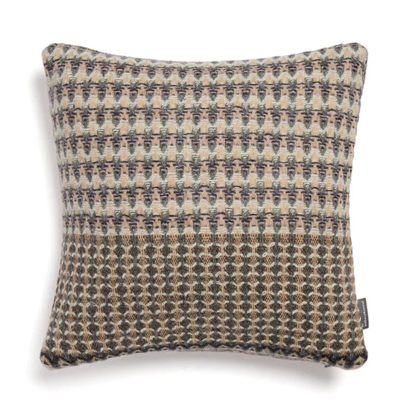 The Ansel Cushion by Wallace & Sewell is made of 100% shetland wool.