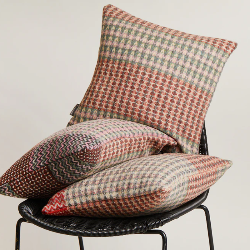 The Bryce Cushion by Wallace & Sewell. Made of 100% Shetland Wool. Shown on a chair.