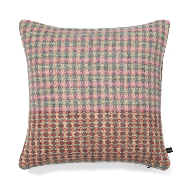 The Bryce Cushion by Wallace & Sewell. Made of 100% Shetland Wool. Cushion with muted sage green, pink, and red tones.