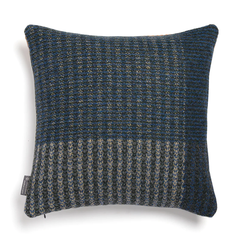 The Cairngorm Shetland Tweed Cushion is a textured pillow with beige and blue pattern.