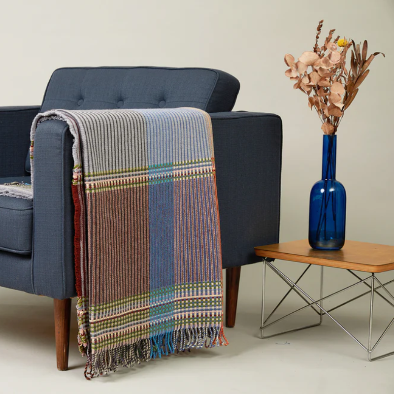 The Joan Throw on an armchair.