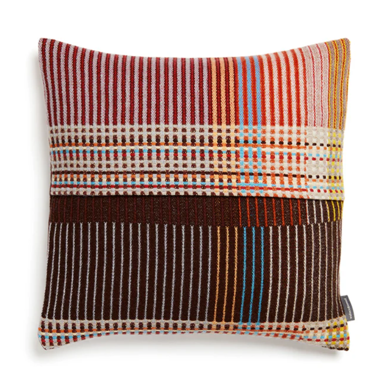 Wallace & Sewell's Pinstripe Sophia cushions feature detailed vertical stripes within areas of bold playful colors like purple, lilac, and yellow.