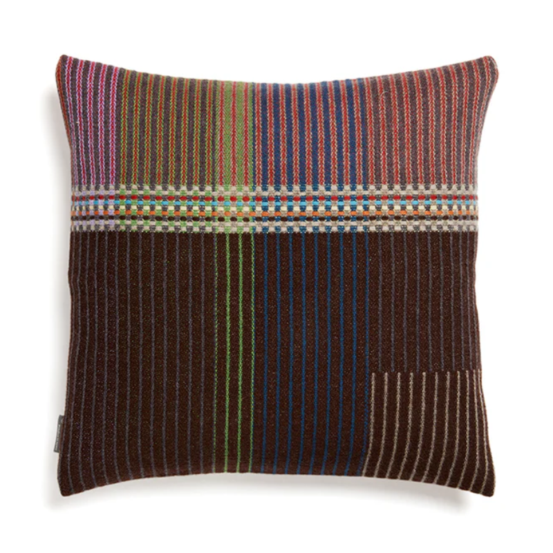 Wallace & Sewell's Pinstripe Sophia cushions feature detailed vertical stripes within areas of bold playful colors like blue, rust, and green.