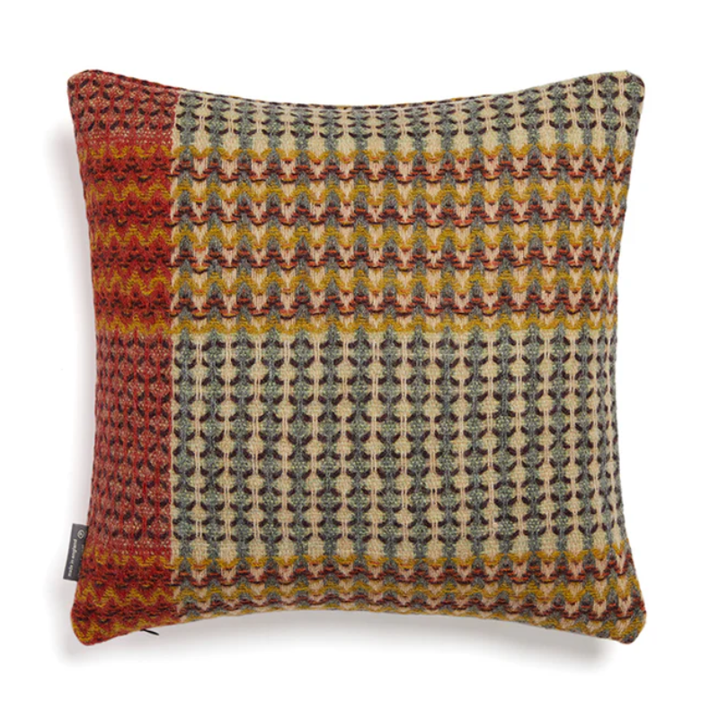 The Yosemite Cushion by Wallace & Sewell is made of Shetland Wool. Cushion with red, blue and yellow accents.