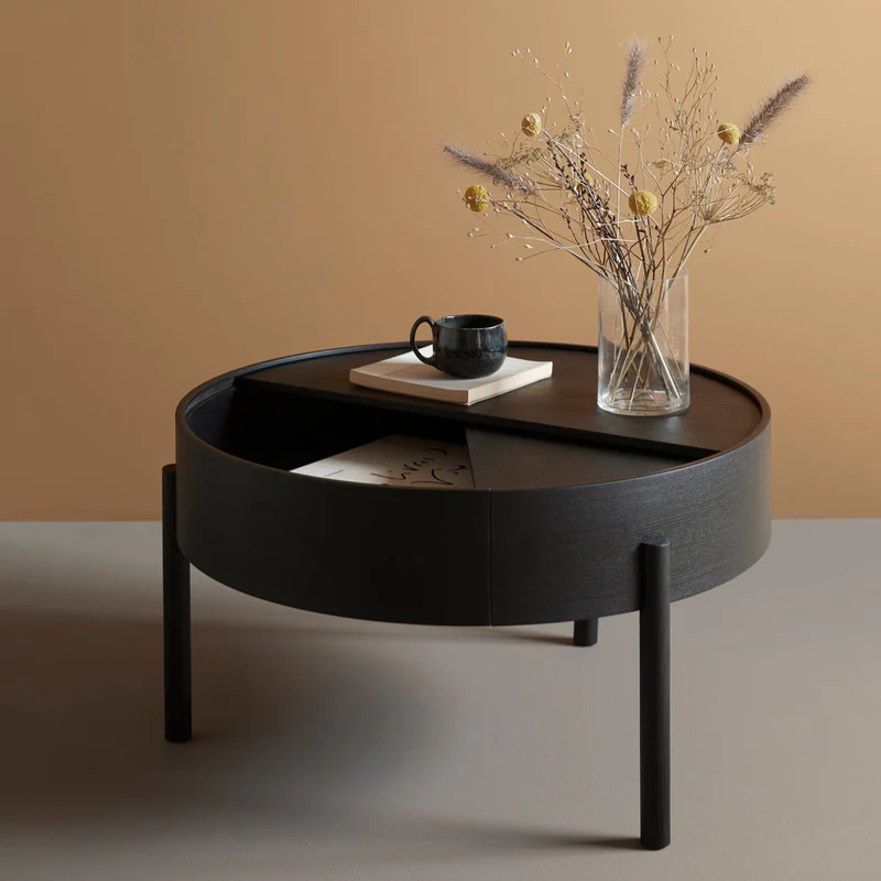 The ARC Coffee Table from Woud in black in a home office.