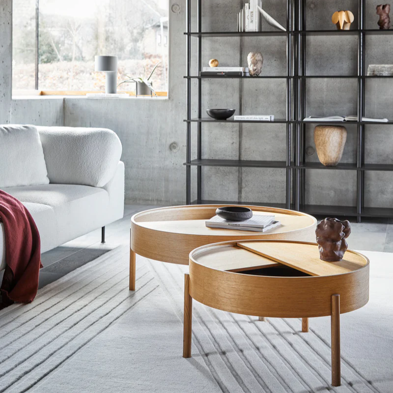 The ARC Coffee Table from Woud in oiled oak in an open space.