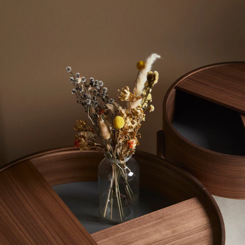 The large 35 inch ARC Coffee Table from Woud in walnut in a hospitality setting.