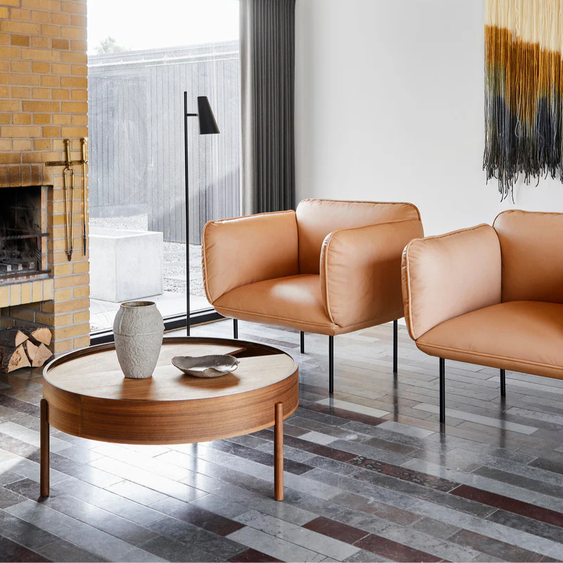 The ARC Coffee Table from Woud in walnut in a lounge.