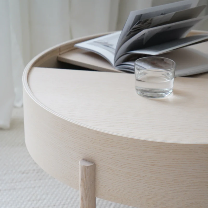 The ARC Coffee Table from Woud in white pigmented ash in a dining area.