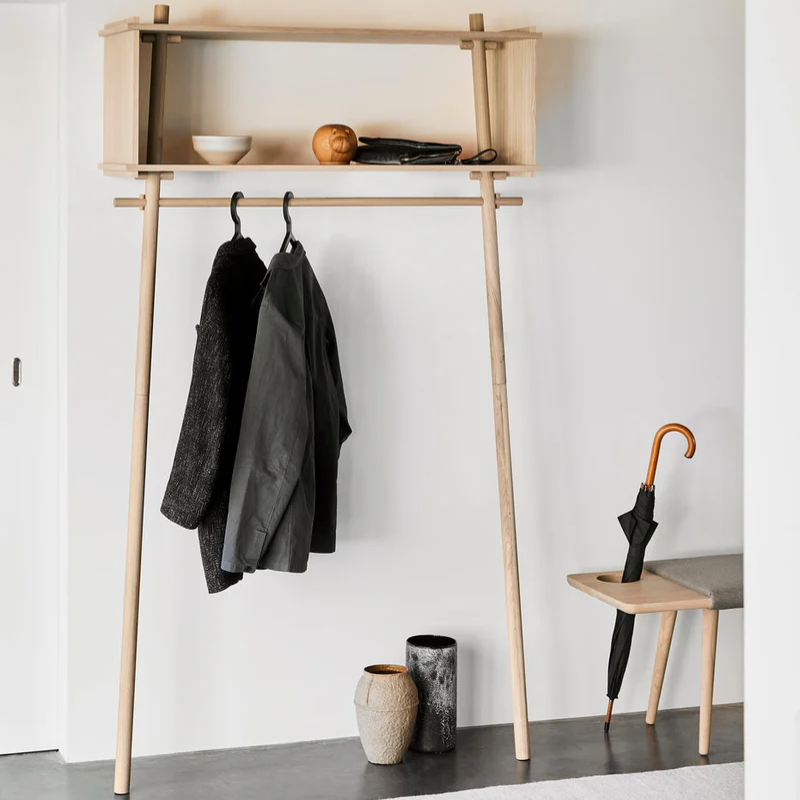 The large Töjbox Wardrobe from Woud in oak in a family area.