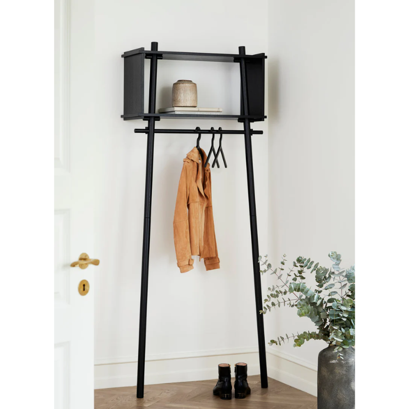 The small Töjbox Wardrobe from Woud in black in an entryway.