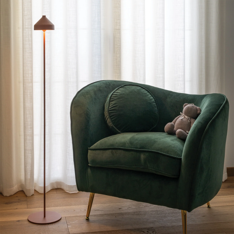 The terracotta Amelie Pro Floor Lamp from Zafferano in a living room. all-groups