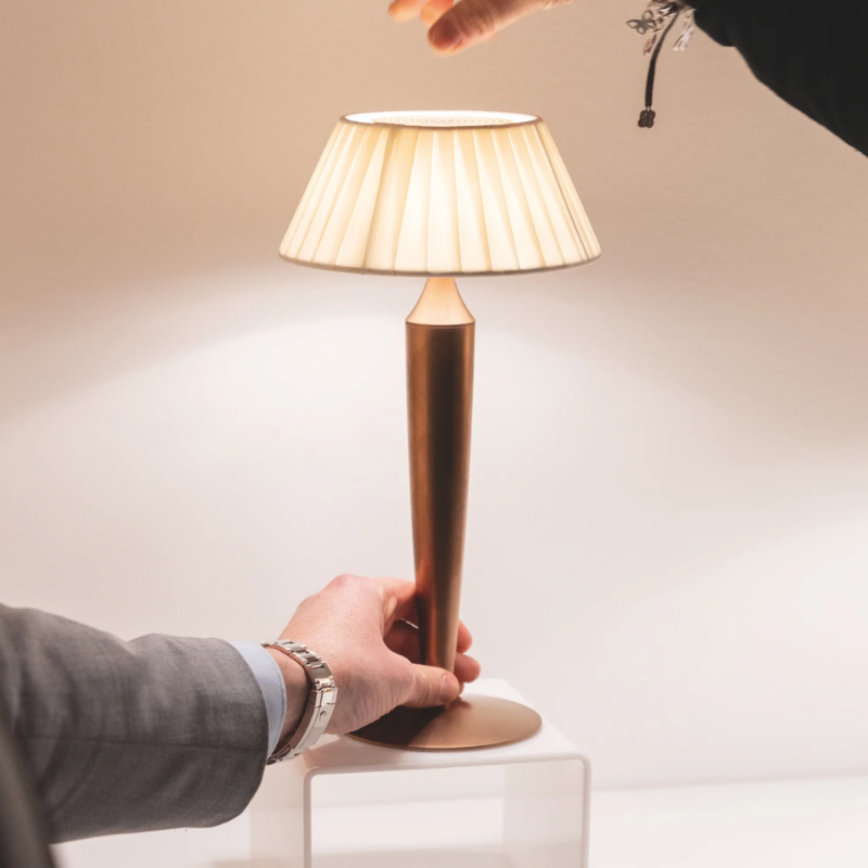 The bronze Flaminia from Zafferano with hand holding from top and base.
