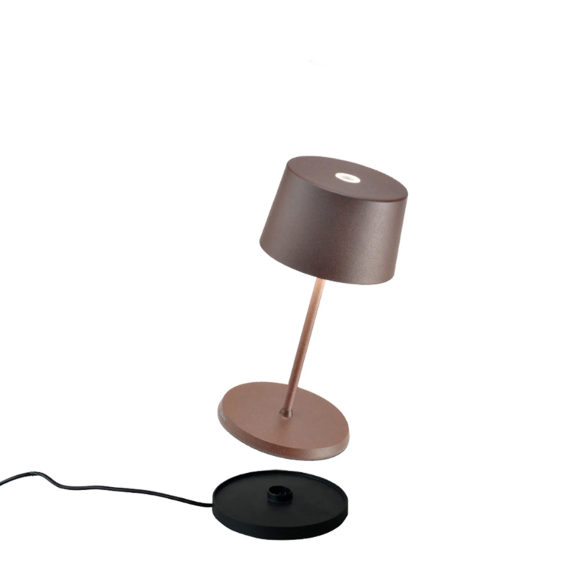 The rust Olivia Pro Mini from Zafferano, a cordless lamp.