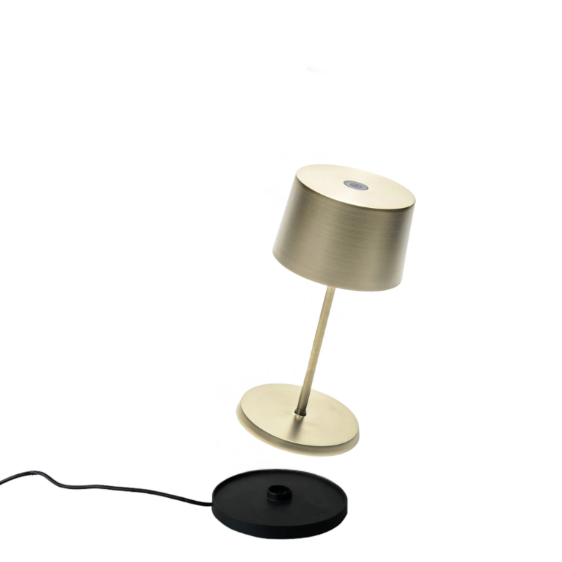 The satin brass Olivia Pro Mini from Zafferano, a cordless lamp.