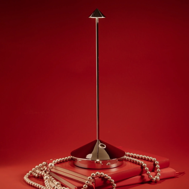 The glossy chrome Pina Pro from Zafferano in a bedroom.