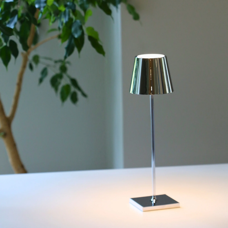 The glossy chrome Poldina Pro from Zafferano in a business space.