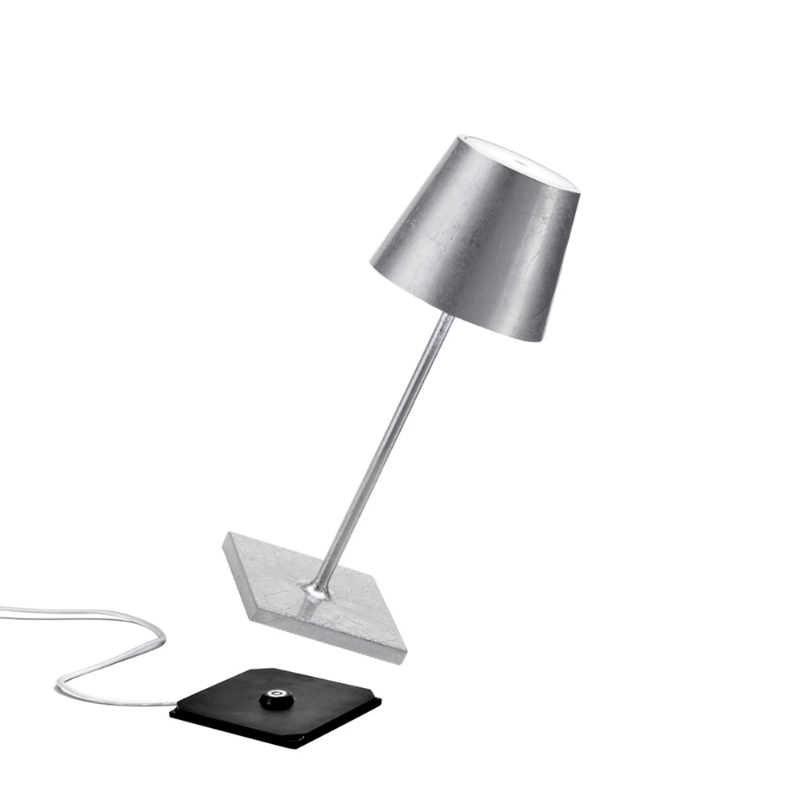 The silver leaf Poldina Pro Mini from Zafferano, a cordless lamp.