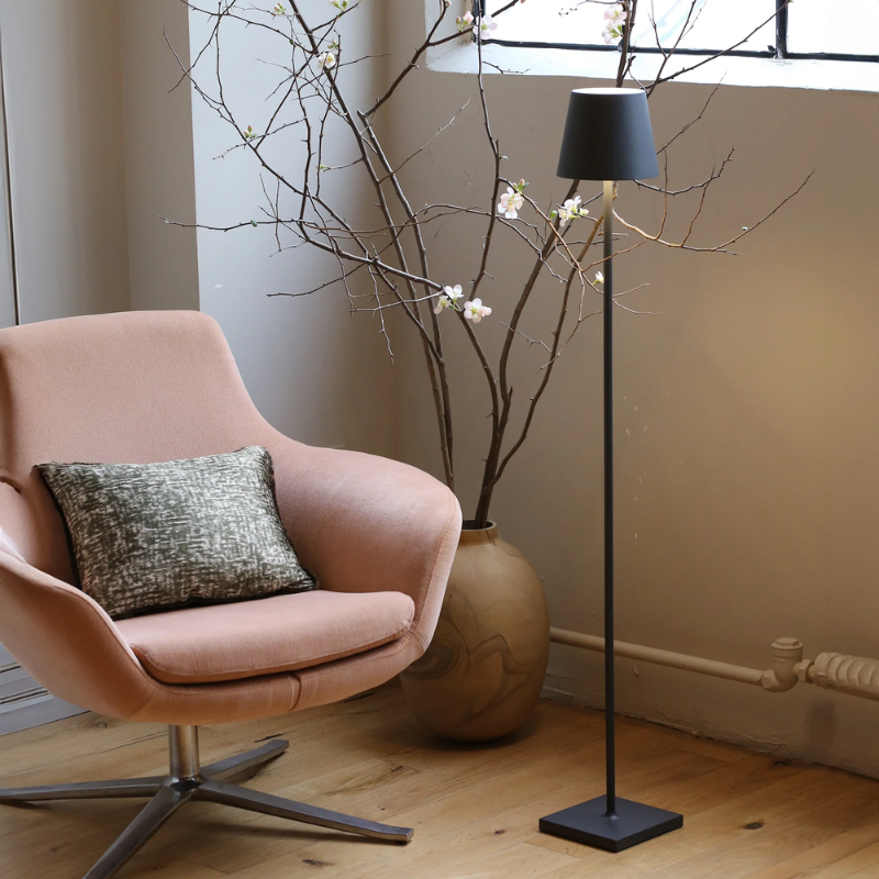 The dark gray Poldina Pro L Floor Lamp from Zafferano in a family area.