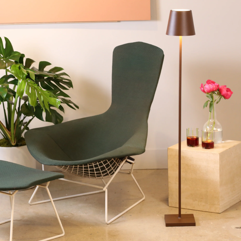 The rust Poldina Pro L Floor Lamp from Zafferano in a living room.