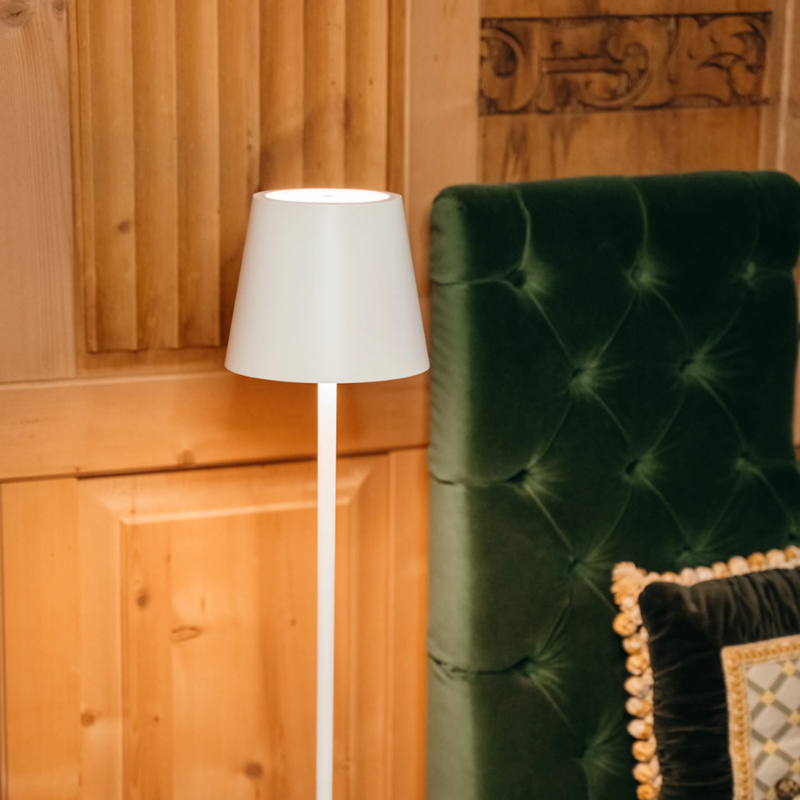 The white Poldina Pro L Floor Lamp from Zafferano in a lounge.