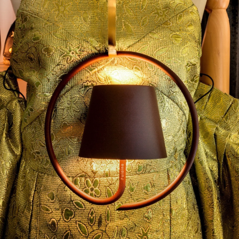 The rust Poldina Pro Suspension Magnetic from Zafferano in a lounge.