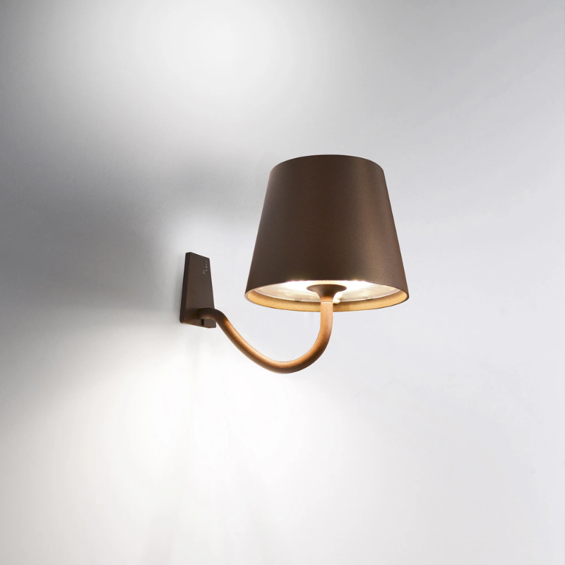 The rust Poldina Pro Wall Magnetic with Mounting Bracket from Zafferano in a living room.