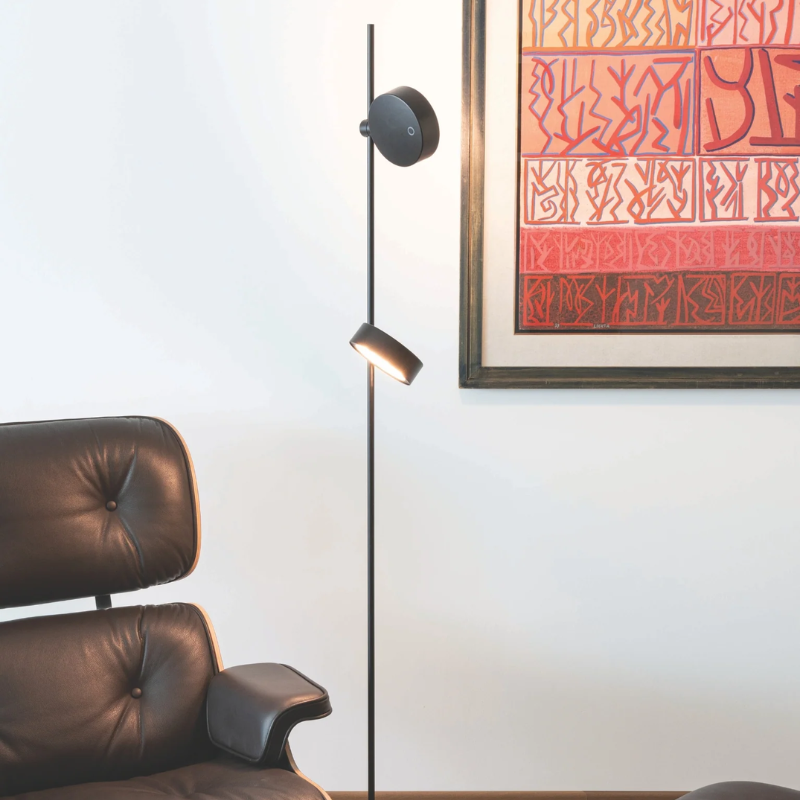 The Super O Floor Lamp from Zafferano in black with two lights in a living room.