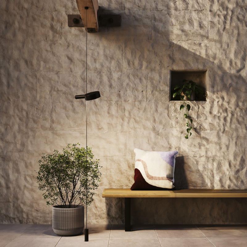 The black Super O Suspended Floor Lamp from Zafferano with one light in a living room.