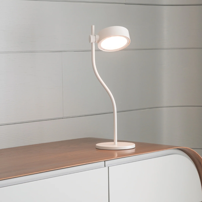 The white Super O Table Lamp from Zafferano in a living room.