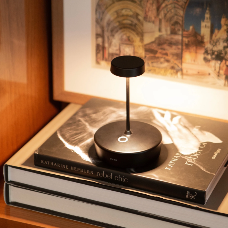 The black Swap Pro Mini from Zafferano in a living room.