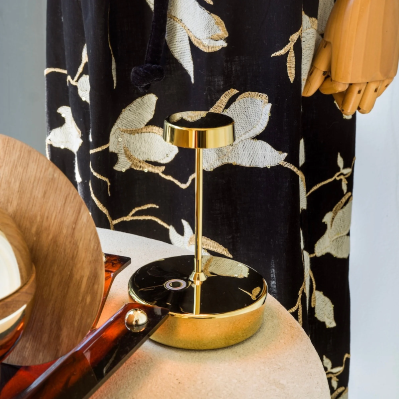 The glossy gold Swap Pro Mini from Zafferano in a family area.