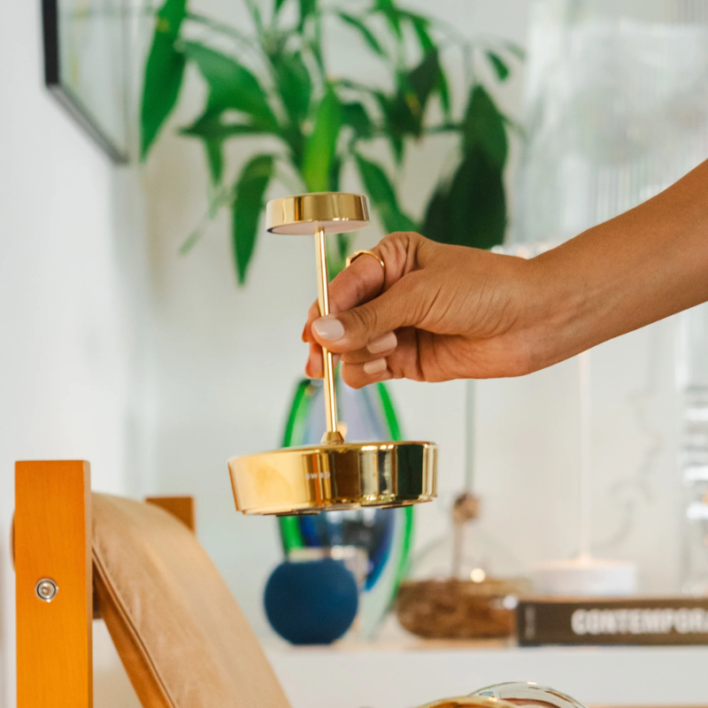 The glossy gold Swap Pro Mini from Zafferano in a family space.